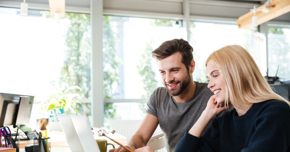 two-persons-happy-laptop
